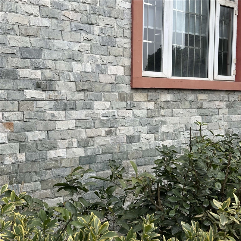 Gray Uniform Chiseled Relief Split Rock Veneer installed on house exterior wall