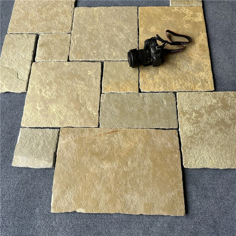 Tumbled beige limestone tiles dry layout sample