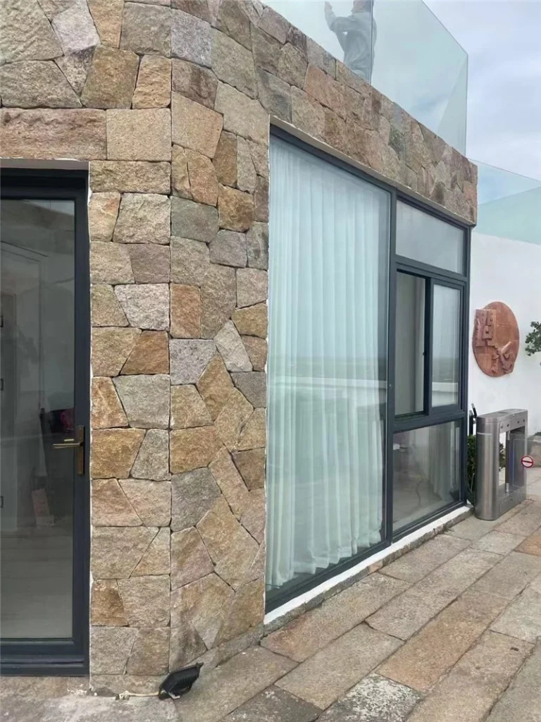 Rust tone stone cladding for villa exterior facade