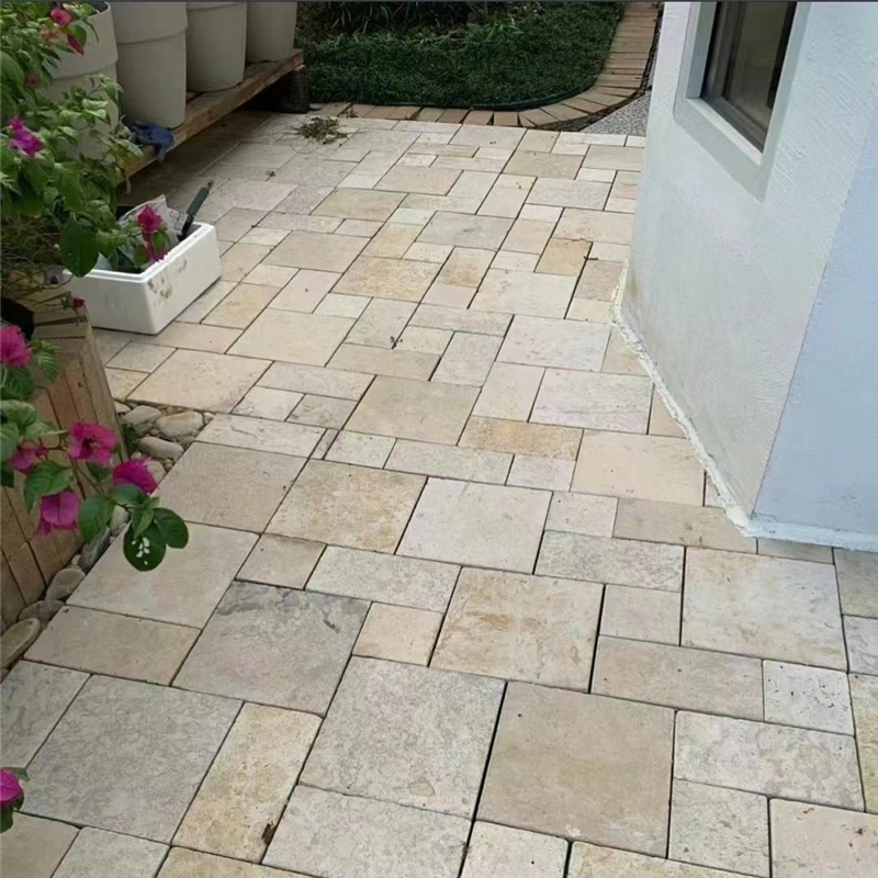 Beige tumbled limestone laid on outdoor patio flooring