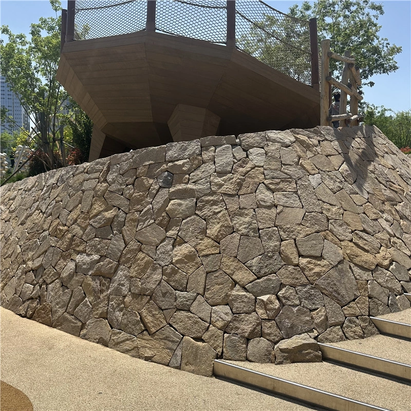 Rust tone stone cladding for garden flower bed edging
