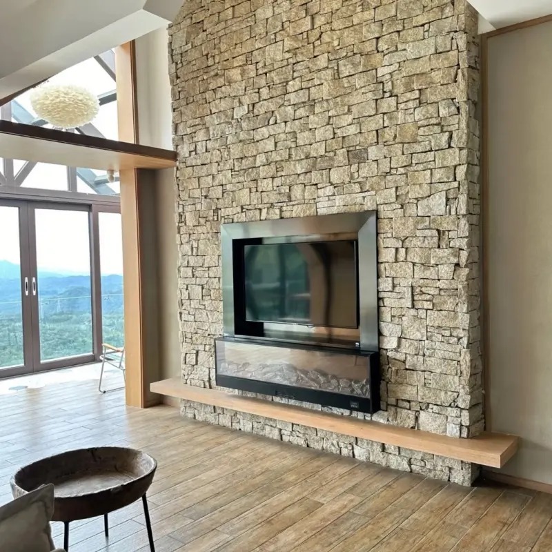 nterior decoration effect of warm golden cream limestone stacked stone panels around fireplace, natural rustic wall veneer
