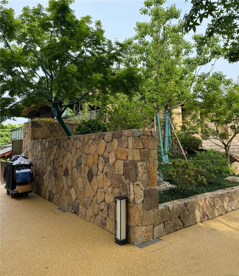 Rust toned crazy paving flagstone landscape wall, natural irregular loose stone for exterior villa garden landscaping