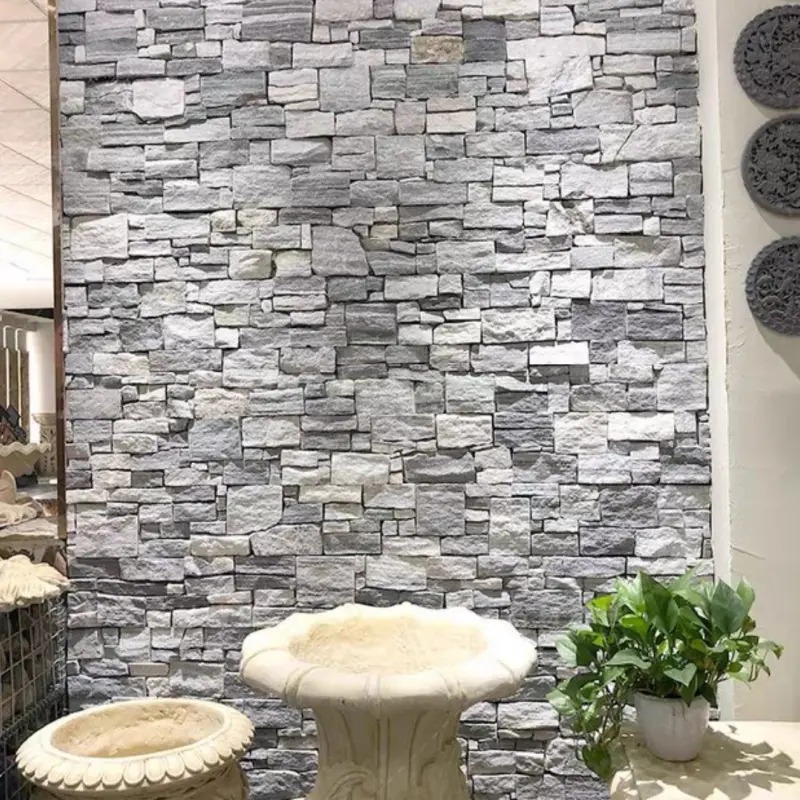 Grey rustic split face stacked stone veneer wall, natural rough ledge stone for indoor vintage decorative wall cladding