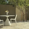 White crazy paving natural stone patio flooring with outdoor furniture in residential garden