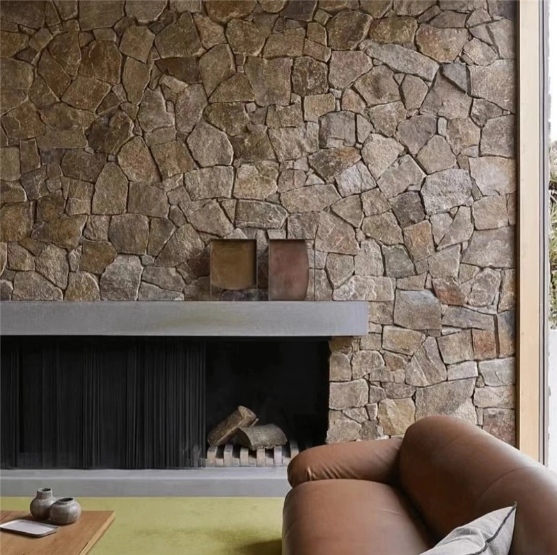 Rusty yellow free‑form stone cladding, irregular crazy paving for interior fireplace feature wall, rustic villa
