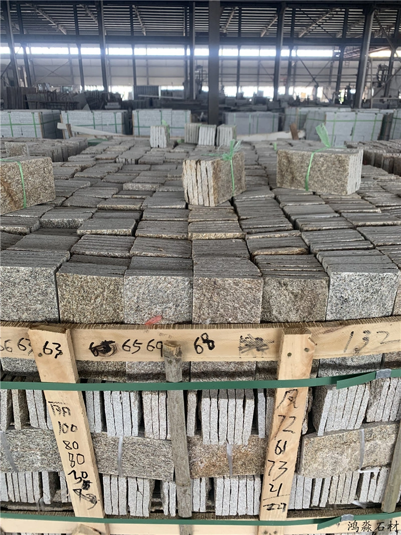 Bulk stock of golden yellow mushroom stone in stone factory warehouse
