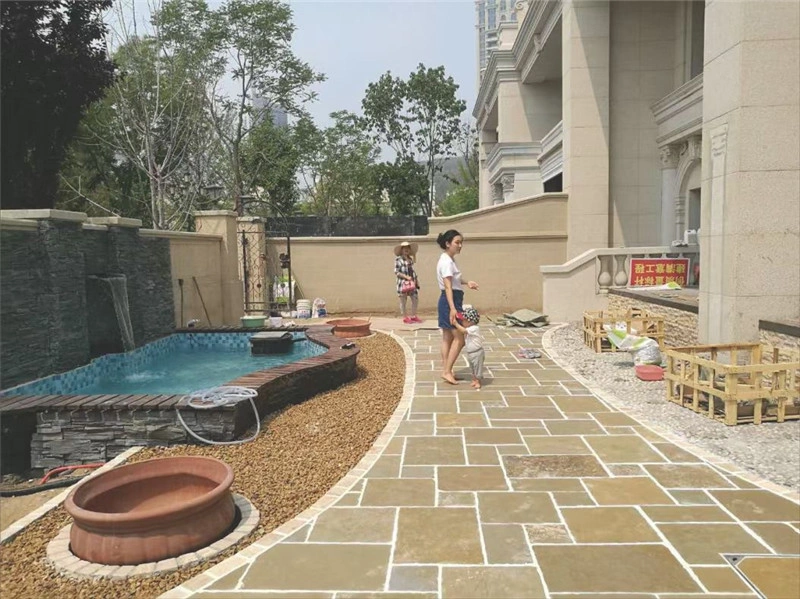 Yellow limestone paving completed villa garden walkway