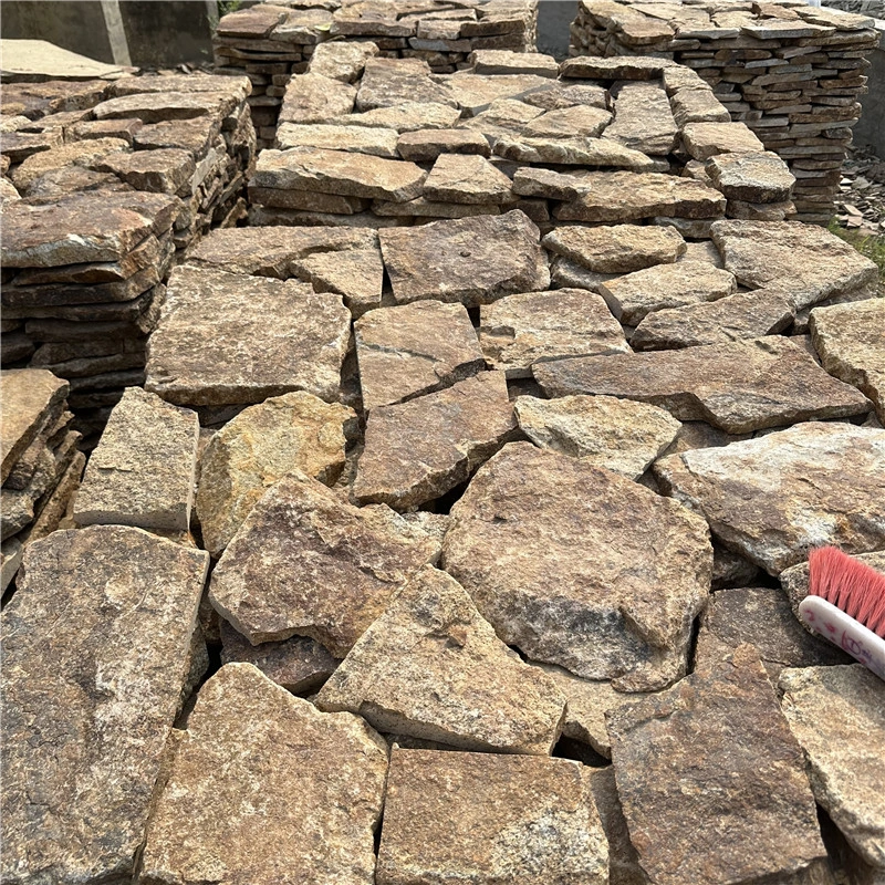 Rust Brown Crazy Paving Stone irregular pieces stacked for residential wall projects