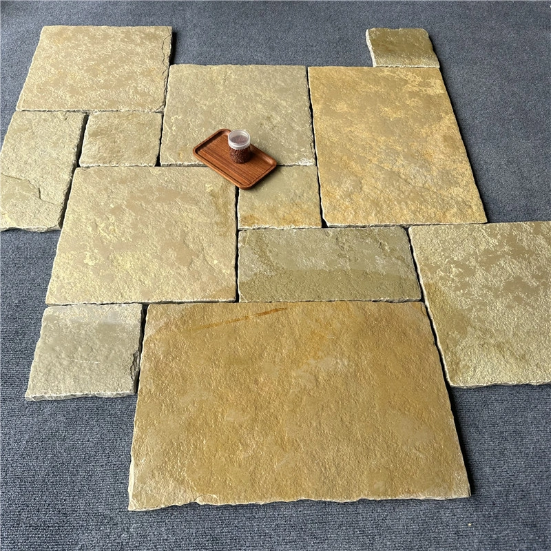 Yellow limestone multi‑size paving slabs natural stone layout sample display