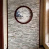 Mixed Grey Stacked Ledger Stone Indoor Feature Wall With Round Decor Window