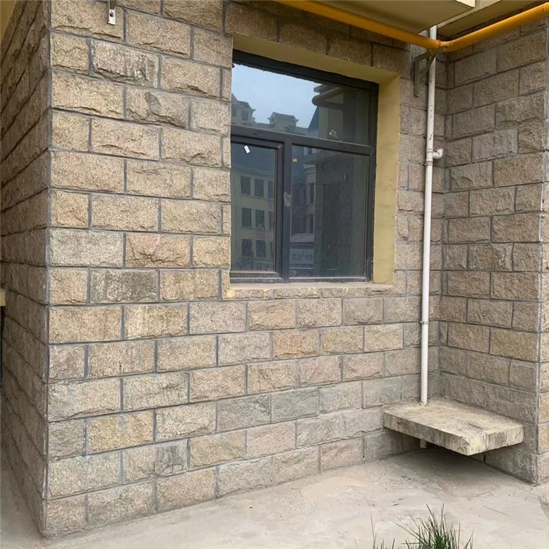 Golden Yellow Mushroom Stone exterior wall cladding on residential building