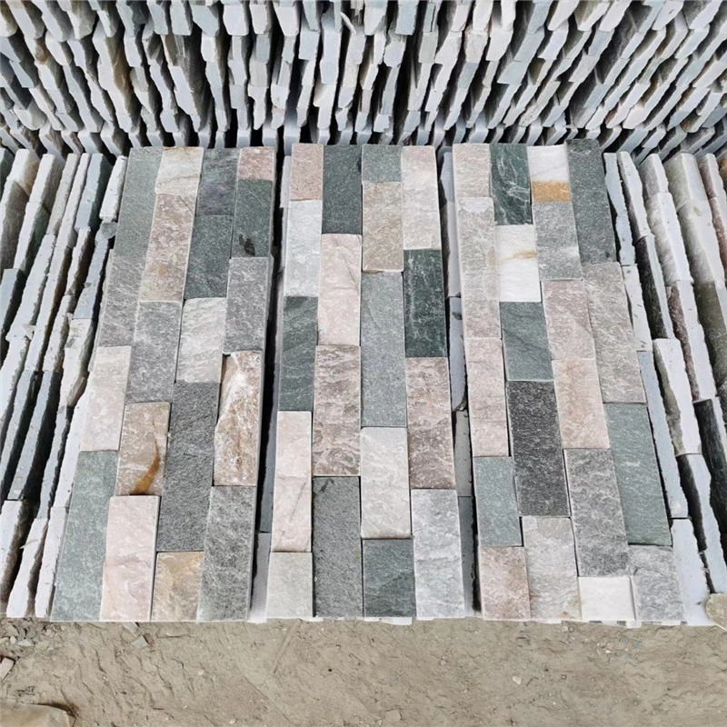 Warehouse stock display of mixed color natural stacked slate ledger stone panels