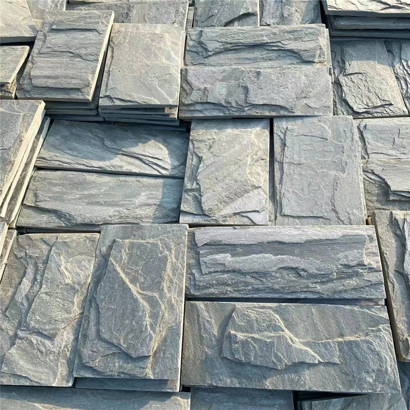 Stock of natural green slate rock-face mushroom stone panels