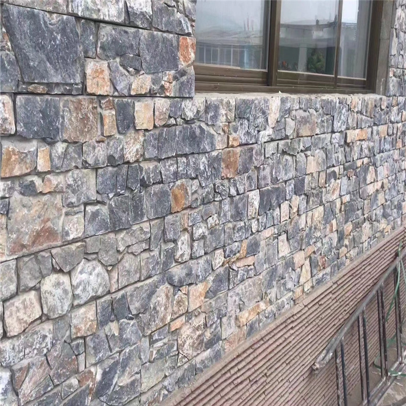 Blue Quartzite Wall Cladding installed on residential building exterior wall