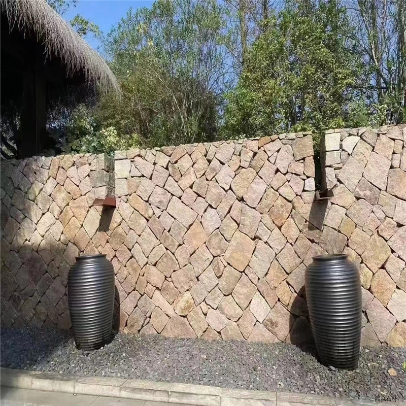 Outdoor garden accent wall with beige crazy paving stone, landscape pottery decoration