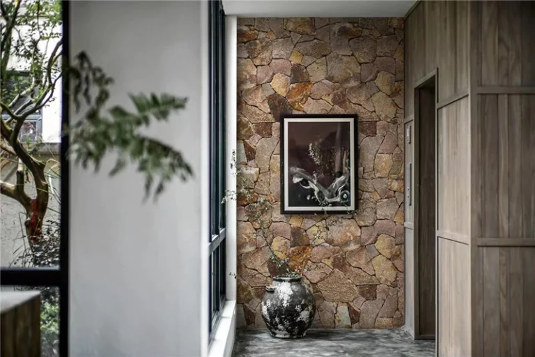 Rusty yellow crazy paving stone cladding, natural irregular stone texture for villa exterior wall facade