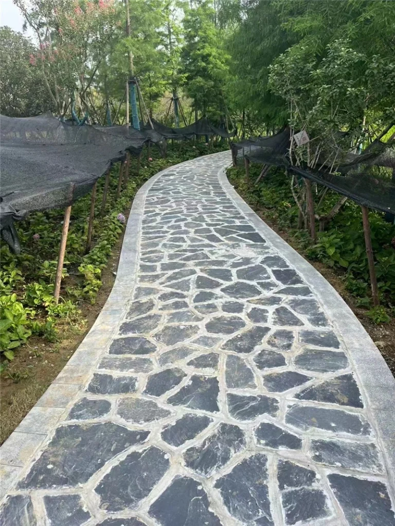 Curved garden walkway with dark grey slate crazy paving, natural split slate outdoor landscape flooring