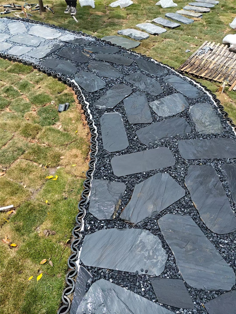 Black slate crazy paving curved garden walkway installation
