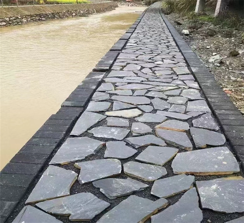Black slate crazy paving long riverside garden walkway