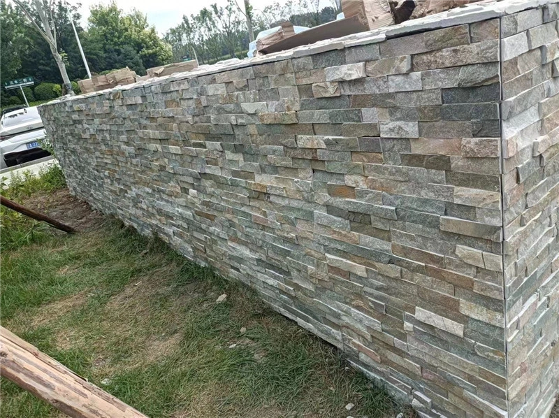 Mixed Grey Stacked Ledger Stone Finished Retaining Wall In Residential Garden