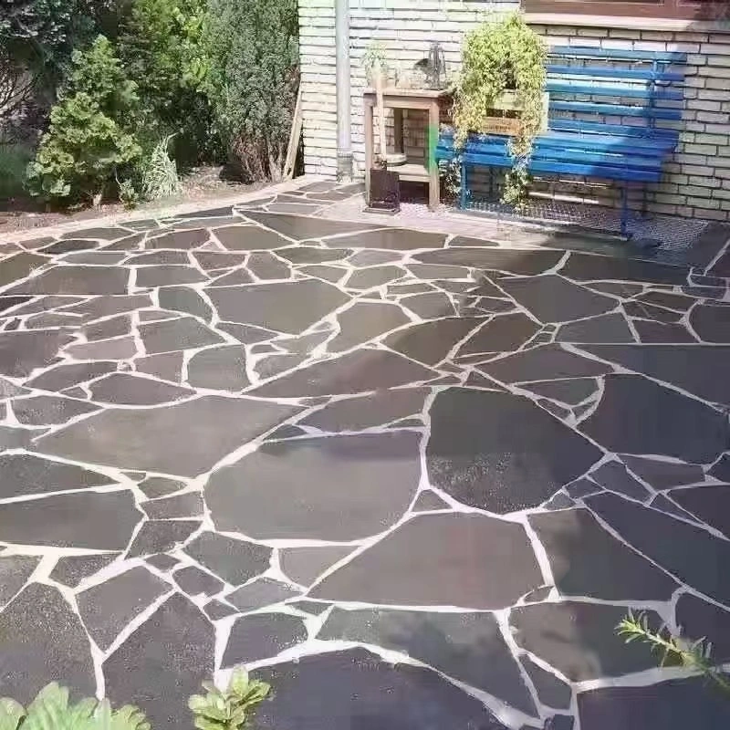 Black slate crazy paving installed for outdoor garden patio flooring