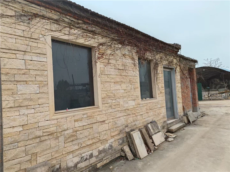 beige limestone ledger stone building exterior wall installation