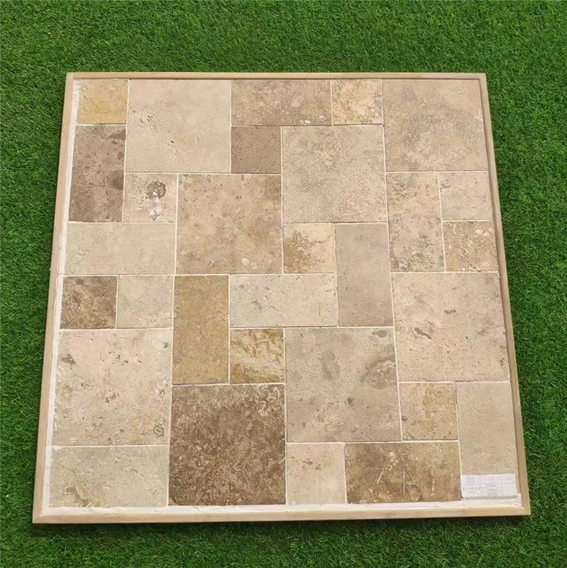 Walnut Brown Limestone French Pattern Tumbled Tile sample board displayed on grass