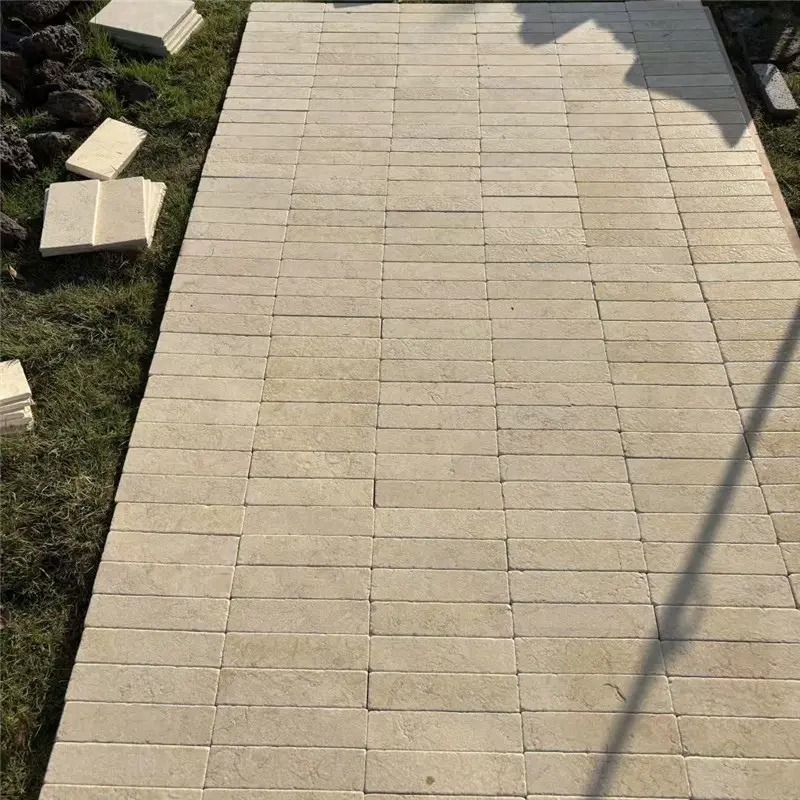 Natural beige travertine strip mosaic laid in straight pattern for exterior floor