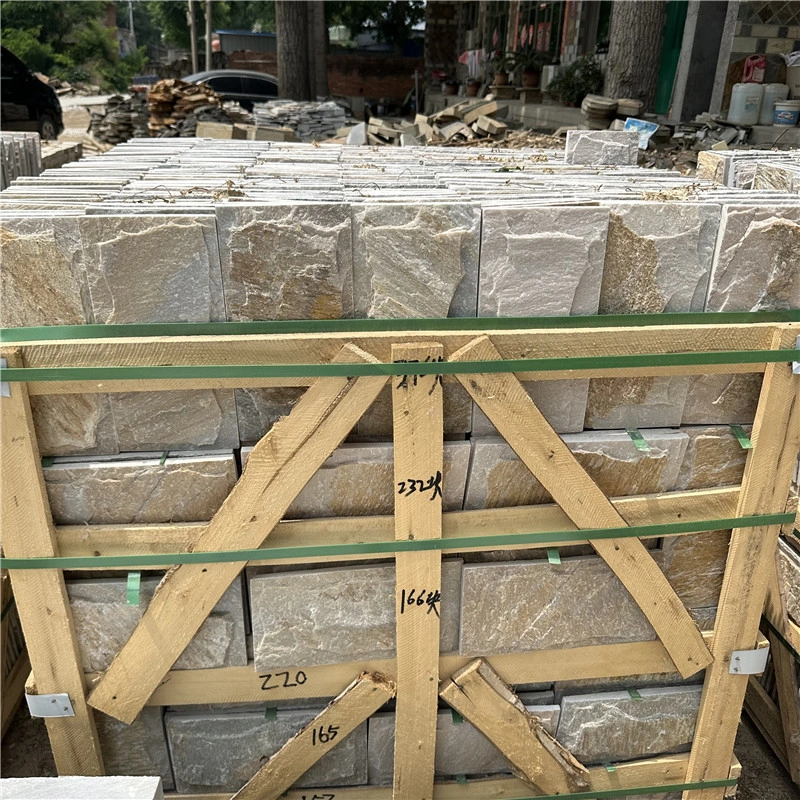Yellow sandstone mushroom stone facade on residential villa building