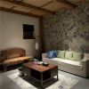 Green‑grey slate crazy paving stone interior feature wall installation