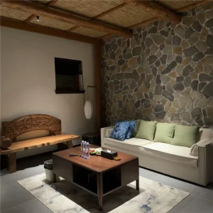 Green‑grey slate crazy paving stone interior feature wall installation