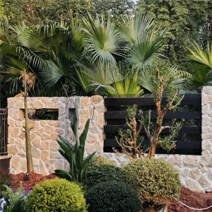 Garden boundary wall built with Warm Yellow Crazy Paving Stone crazy paving stone