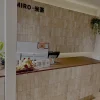 Beige travertine strip mosaic feature wall, natural travertine stone cladding for commercial reception counter backdrop