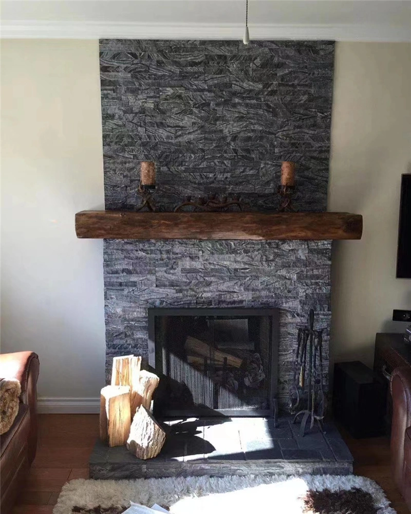 Black quartzite ledger stone veneer for indoor fireplace accent wall