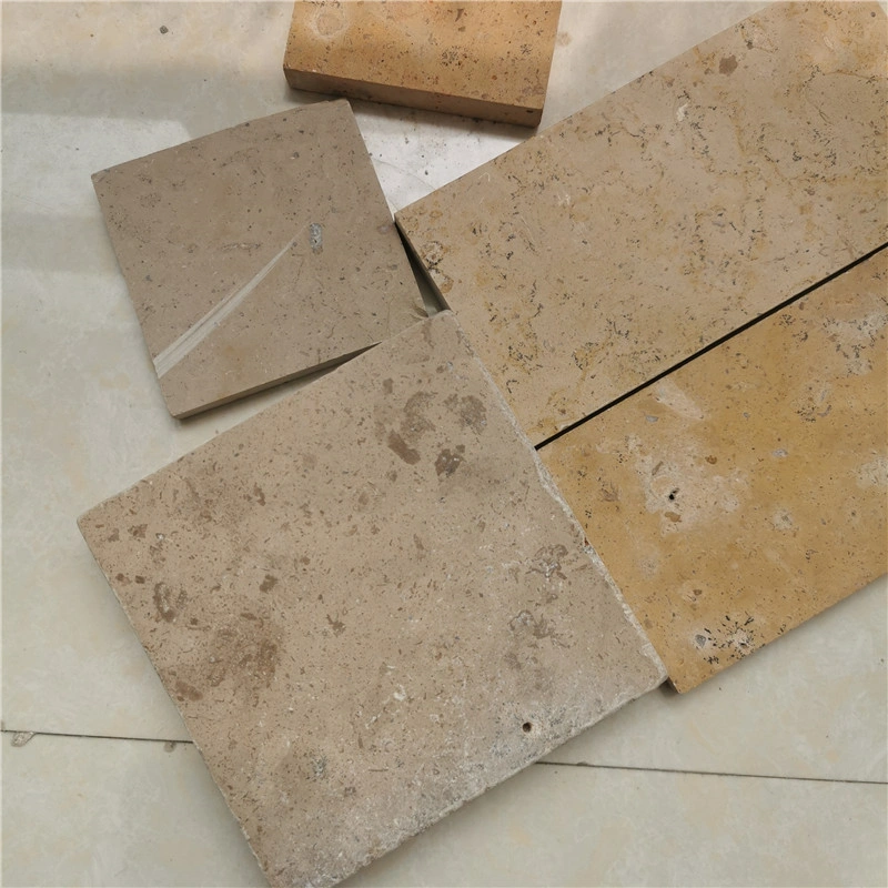 Walnut Brown Limestone Tumbled Tile stock stacked for supply