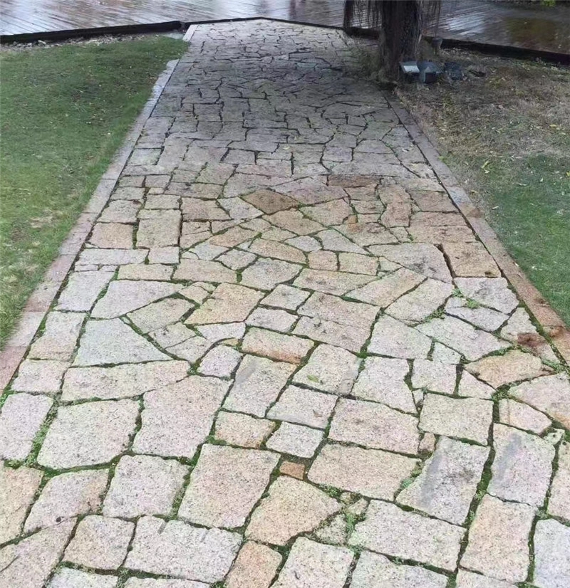 Yellow Crazy Paving Stone garden walkway with grass joints for outdoor villa landscape pathway