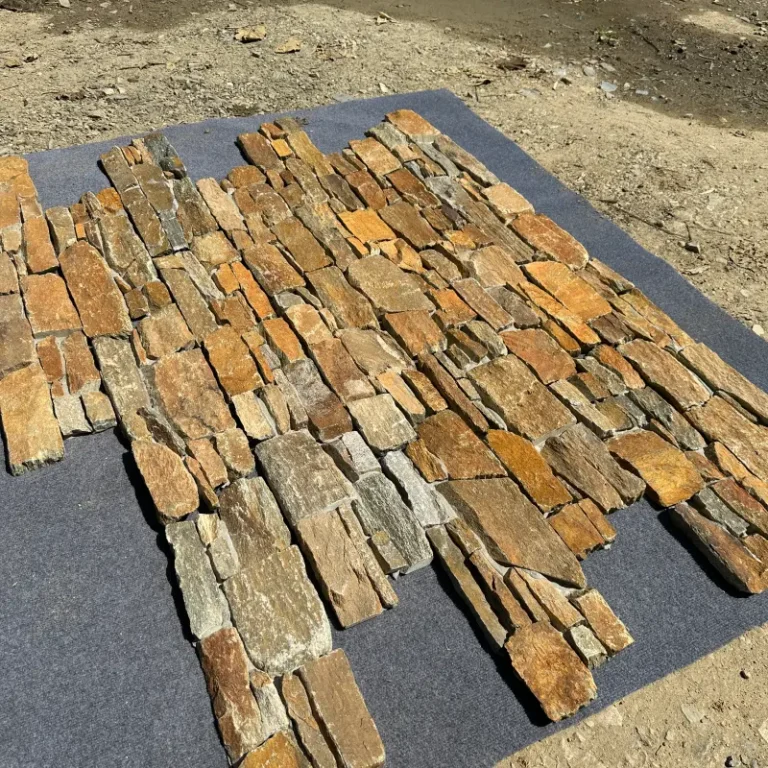 Rust colored natural stone ledger panels pre‑assembled on mesh for easy installation