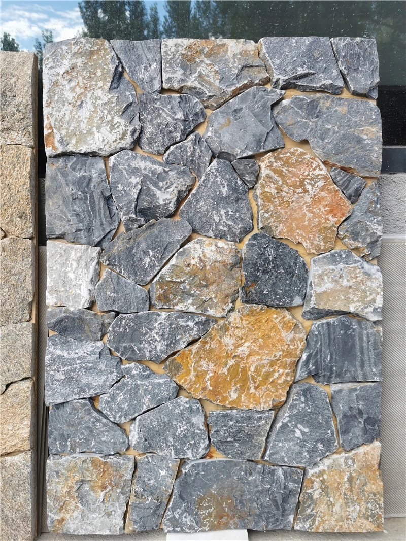 Blue Grey Slate Crazy Paving on outdoor low garden wall