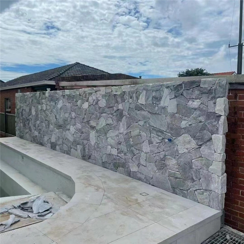 Light Blue Crazy Paving Stone wall cladding around a residential swimming pool