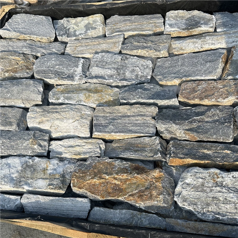 Close-up of Rustic Grey Stacked Stone veneer showing natural split-face texture