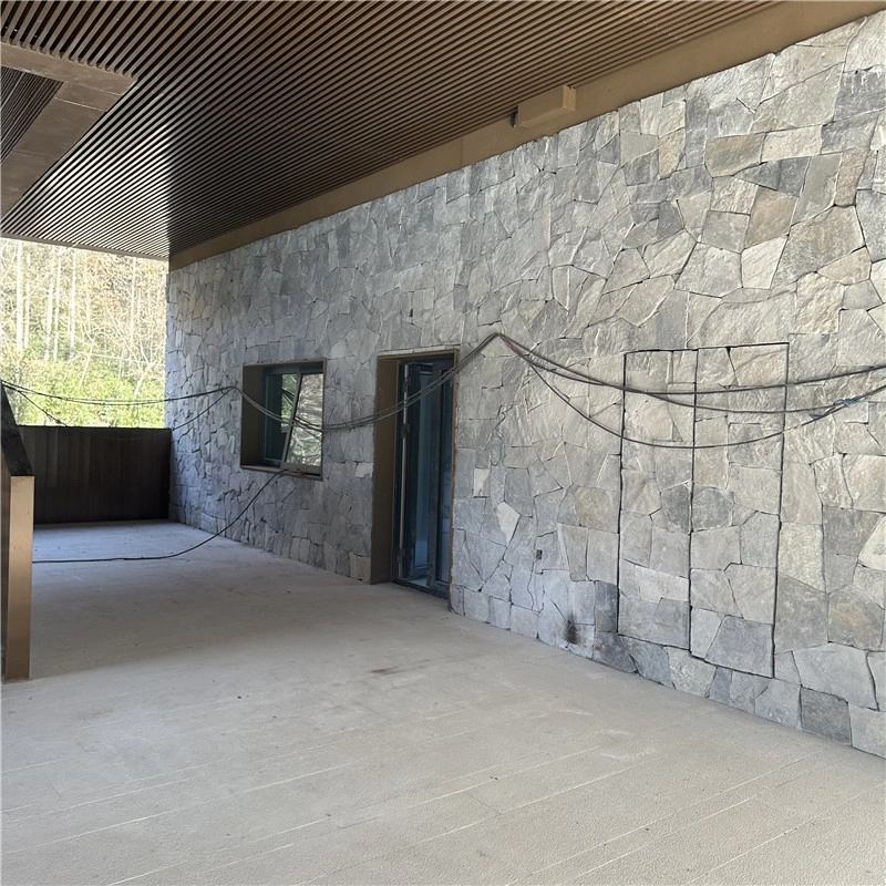 Light Blue Crazy Paving Stone natural slate cladding on long exterior corridor wall