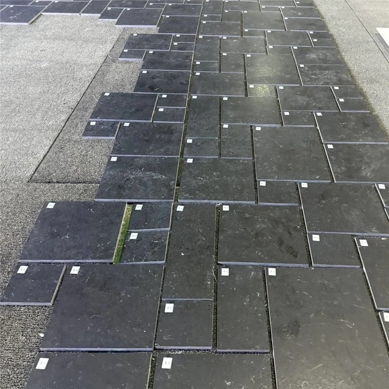 Black Limestone with Gold Veining, raw natural stone slabs stacked at factory yard