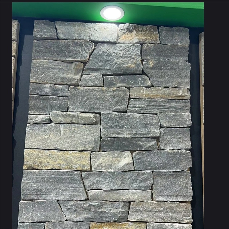 Rustic Grey Stacked Stone veneer sample wall in an indoor showroom