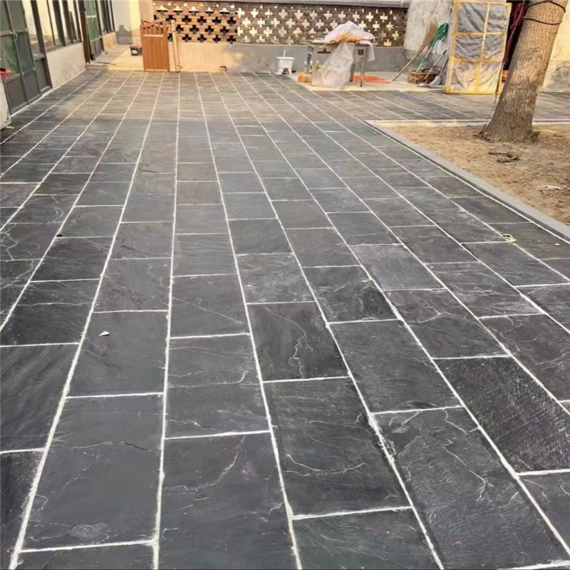 Black Natural Riven Slate, natural riven slate paving in a large outdoor area
