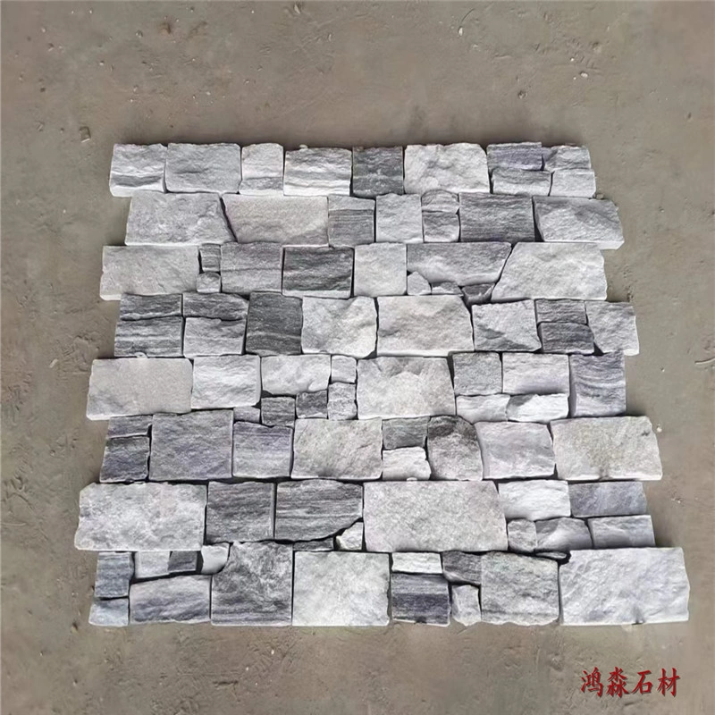 Mesh‑back grey slate ledger panel, natural split‑face stacked stone sheet