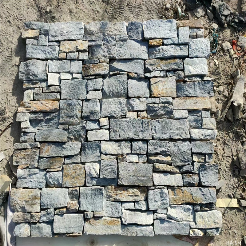 Blue Grey Slate Stacked Stone boundary retaining wall for a commercial outdoor project