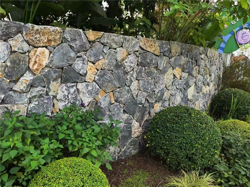 Dusky Purple Crazy Paving garden low wall with green planting