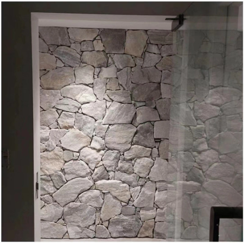 Grey irregular natural stone interior accent wall beside doorway
