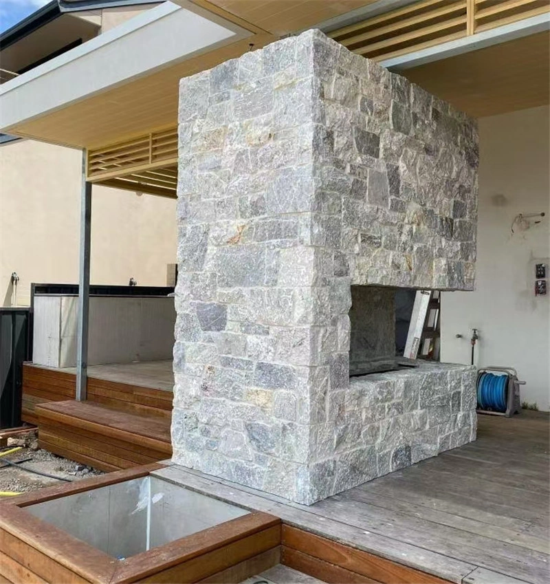 Grey slate ledger panel veneer for outdoor fireplace construction